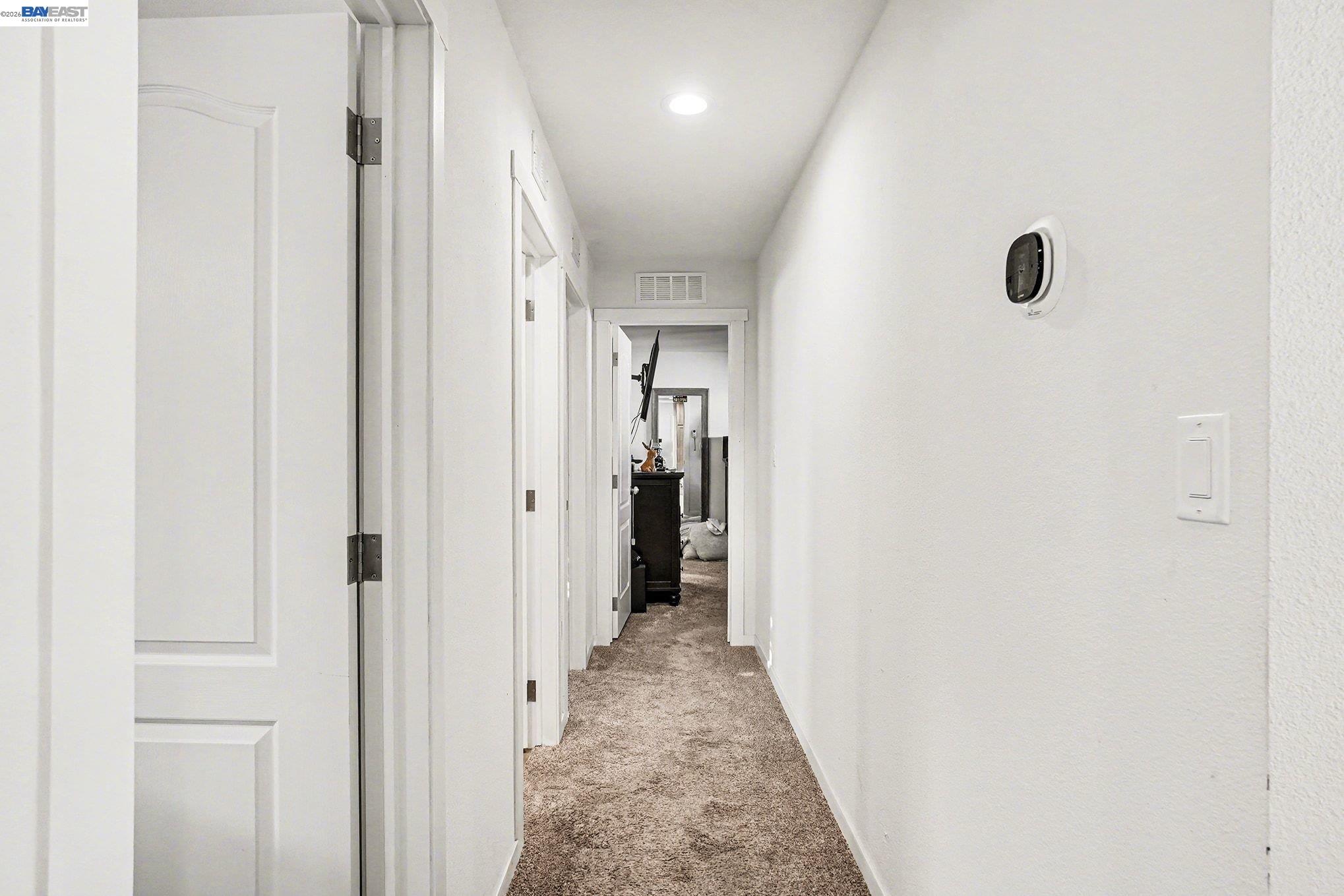 16711 Marsh Creek Road, Unit 150 Clayton, CA 94517 - Photo 7 of 19 a view of a hallway with wooden floor