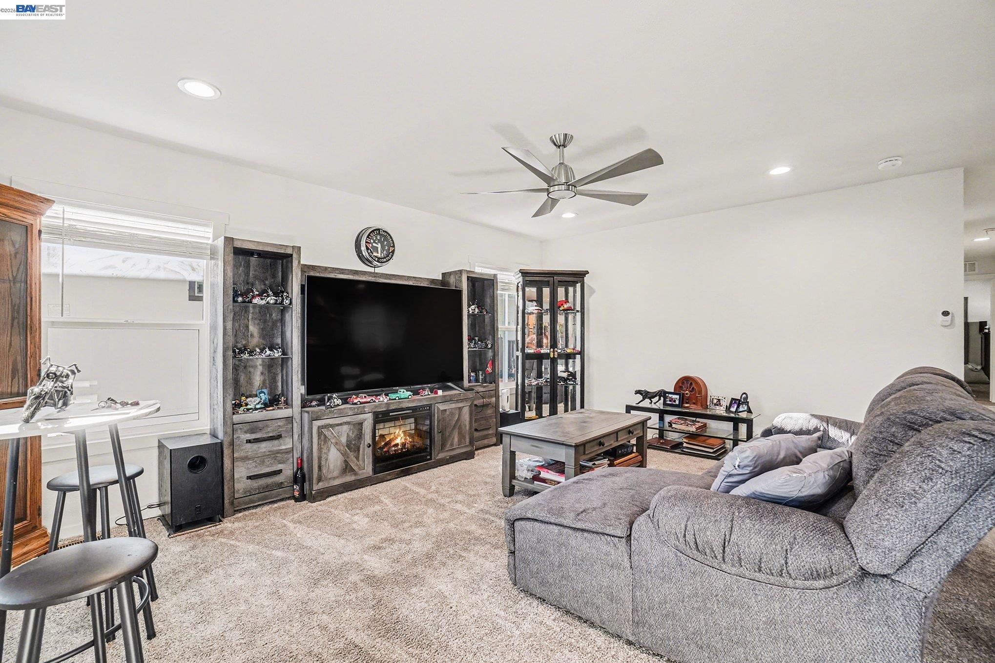 16711 Marsh Creek Road, Unit 150 Clayton, CA 94517 - Photo 9 of 19 a living room with furniture and a flat screen tv