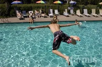 a view of a house with a swimming pool