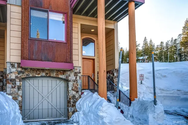 a kitchen with stainless steel appliances granite countertop sink stove and refrigerator