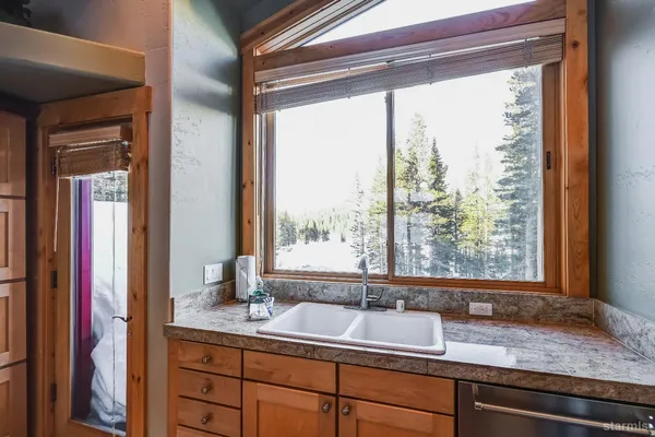 a view of bathroom with sink and mirror