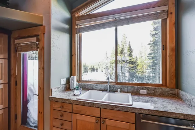 a view of bathroom with sink and mirror