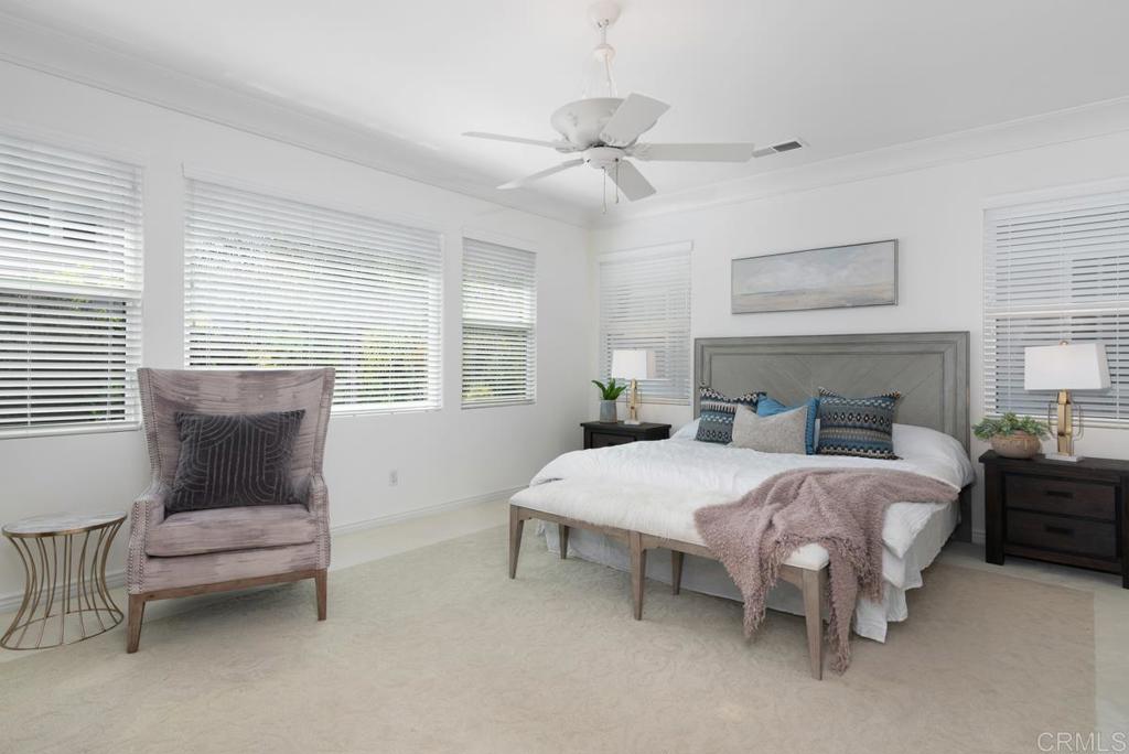 5473 Valerio Trail San Diego, CA 92130 - Photo 20 of 39 a bedroom with a bed and a couch