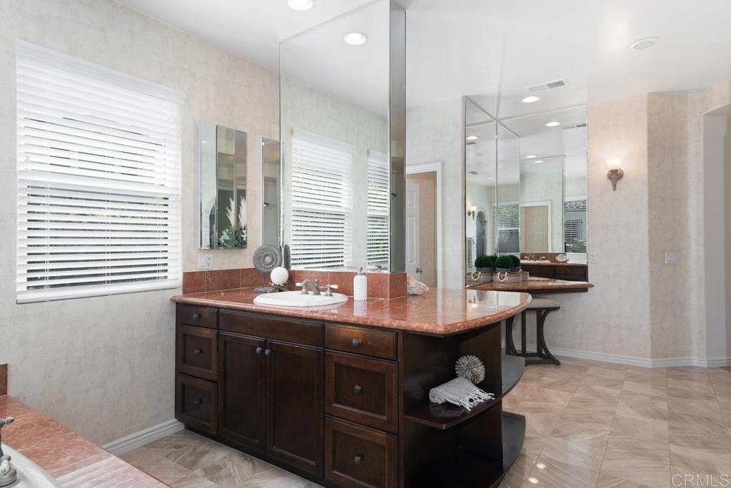 5473 Valerio Trail San Diego, CA 92130 - Photo 23 of 39 a kitchen with a sink and a refrigerator