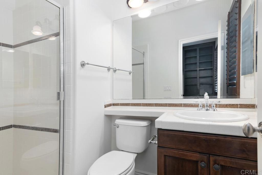 5473 Valerio Trail San Diego, CA 92130 - Photo 31 of 39 a bathroom with a sink toilet and shower