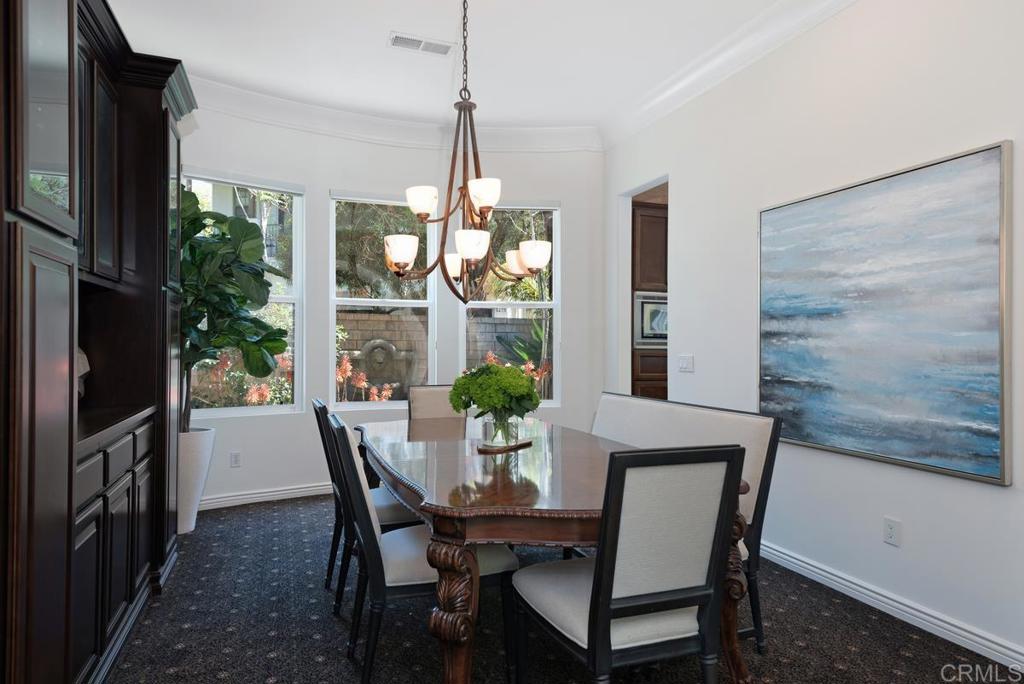 5473 Valerio Trail San Diego, CA 92130 - Photo 5 of 39 a view of a dining room with furniture window and outside view