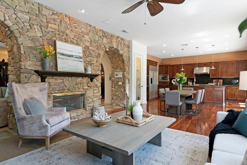 5473 Valerio Trail San Diego, CA 92130 - Photo 8 of 39 a living room with furniture and a fireplace