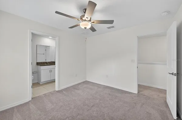 a view of a livingroom with a ceiling fan