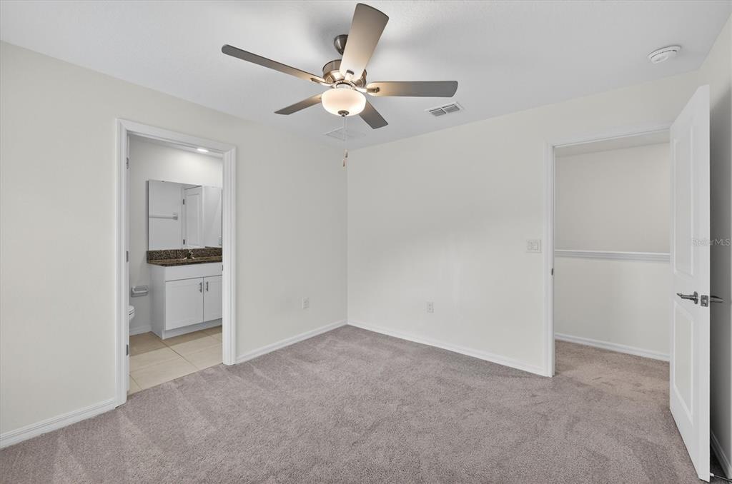 6956 Ripple Pond Loop Zephyrhills, FL 33541 - Photo 24 of 30 a view of a livingroom with a ceiling fan