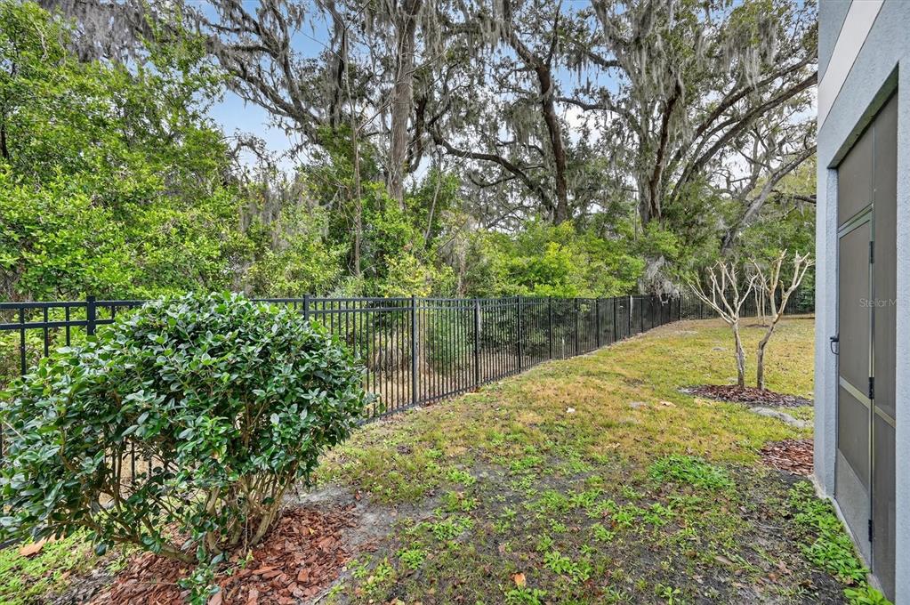 6956 Ripple Pond Loop Zephyrhills, FL 33541 - Photo 30 of 30 a view of a garden with a lake