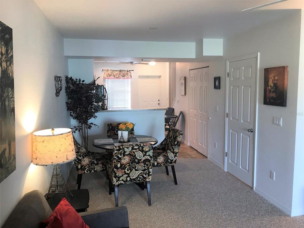 26386 Nadir Road, Unit 401 Punta Gorda, FL 33983 - Photo 14 of 42 a living room with furniture and wooden floor