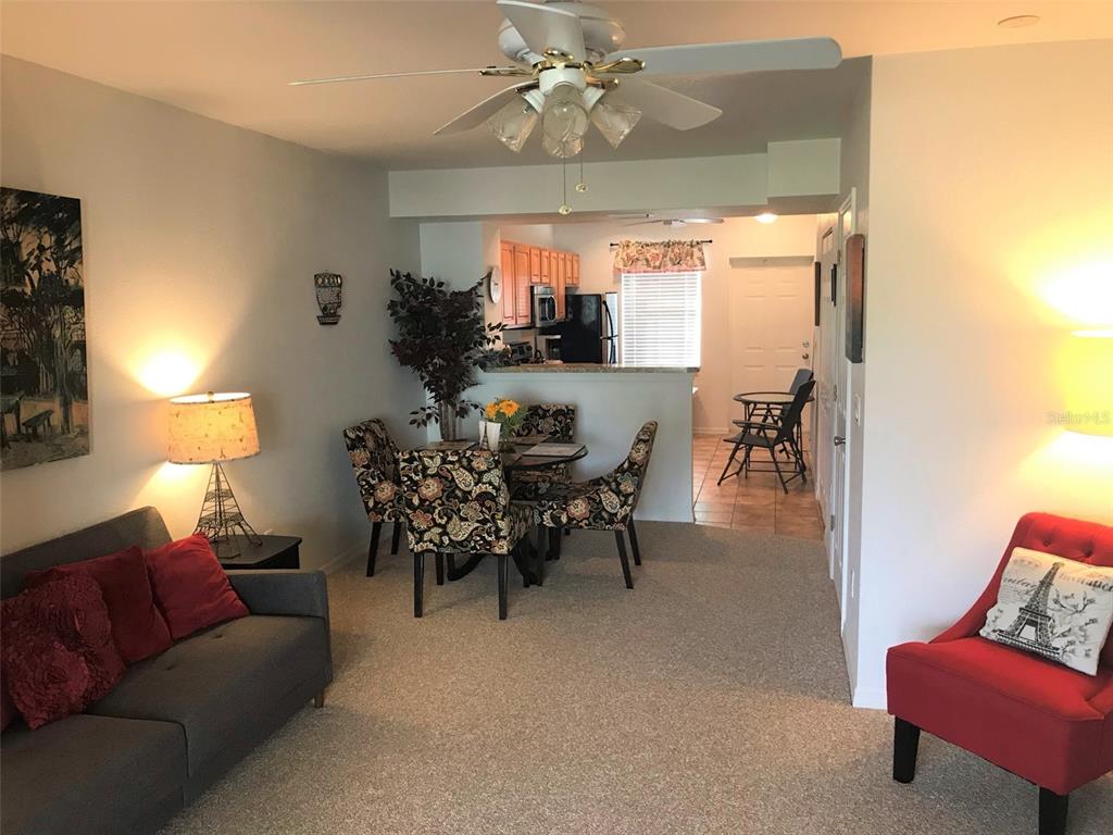 26386 Nadir Road, Unit 401 Punta Gorda, FL 33983 - Photo 16 of 42 a living room with furniture and a large window