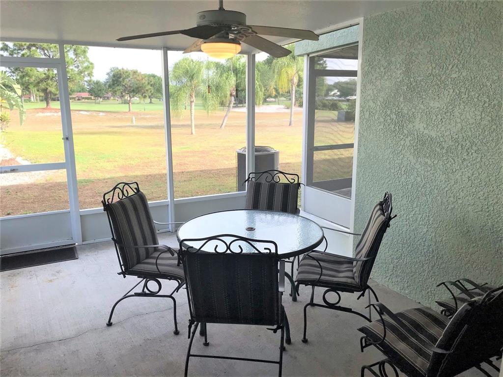 26386 Nadir Road, Unit 401 Punta Gorda, FL 33983 - Photo 17 of 42 a view of a dining room with furniture window and outside view
