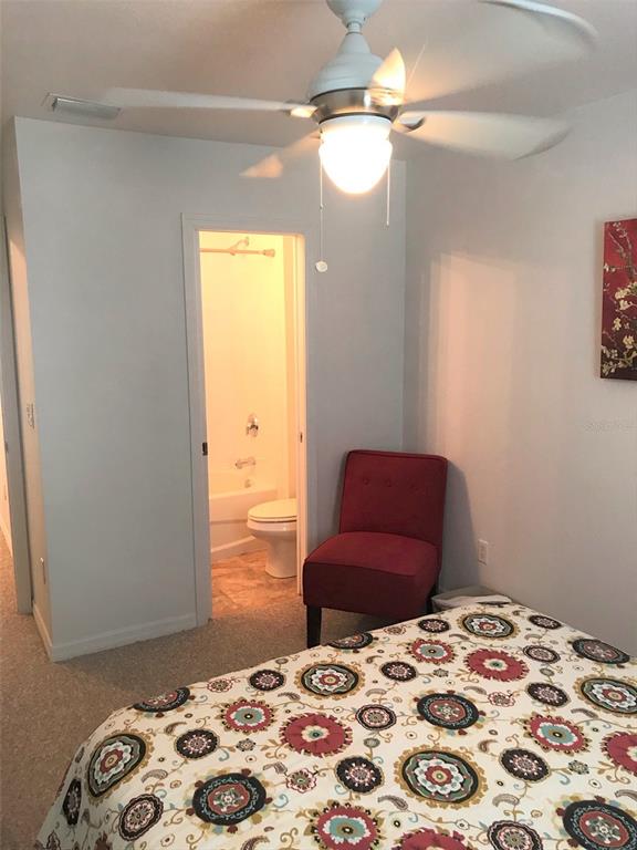 26386 Nadir Road, Unit 401 Punta Gorda, FL 33983 - Photo 23 of 42 a bedroom with a bed and a dresser