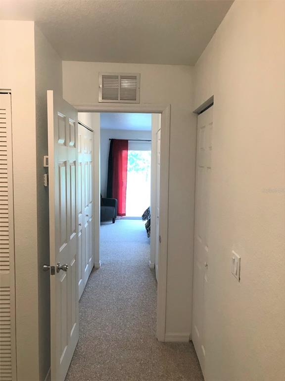 26386 Nadir Road, Unit 401 Punta Gorda, FL 33983 - Photo 29 of 42 a view of hallway with chandelier