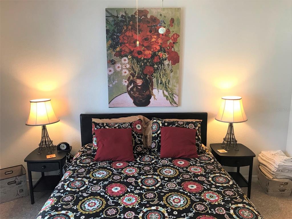 26386 Nadir Road, Unit 401 Punta Gorda, FL 33983 - Photo 34 of 42 a bed room with a bed and a lamp