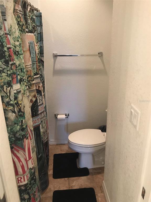 26386 Nadir Road, Unit 401 Punta Gorda, FL 33983 - Photo 37 of 42 a bathroom with a toilet and a shower