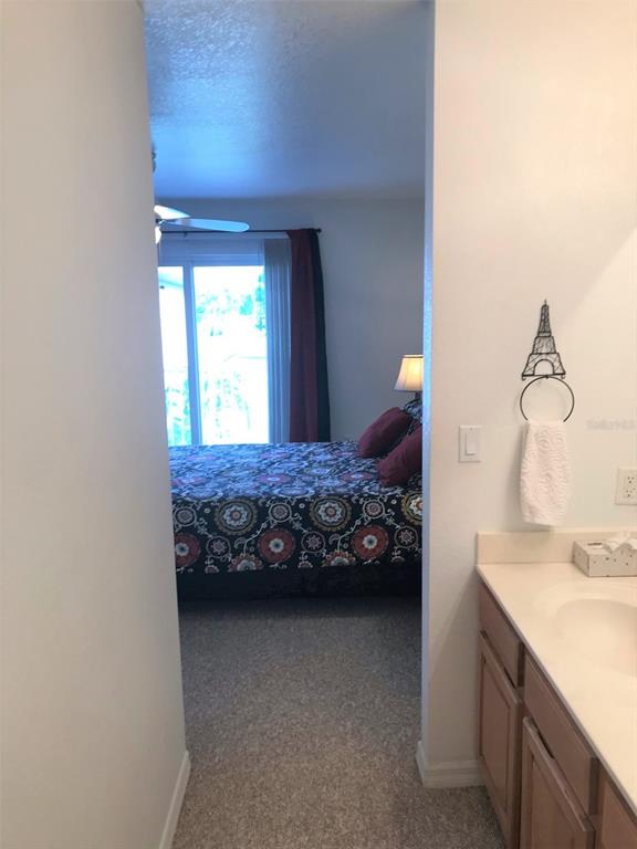 26386 Nadir Road, Unit 401 Punta Gorda, FL 33983 - Photo 40 of 42 a bedroom with a bed and a dresser