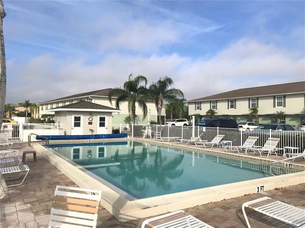 26386 Nadir Road, Unit 401 Punta Gorda, FL 33983 - Photo 42 of 42 a view of a swimming pool with outdoor seating