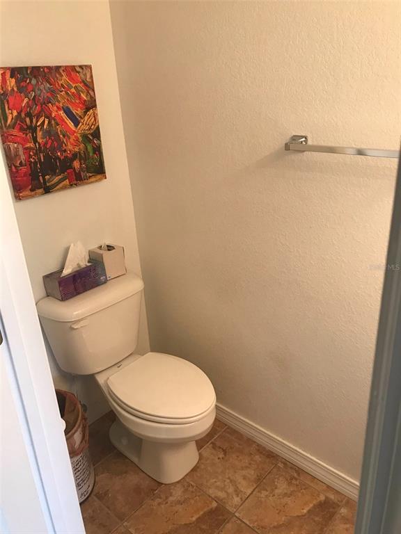 26386 Nadir Road, Unit 401 Punta Gorda, FL 33983 - Photo 10 of 42 a white toilet sitting next to a shower