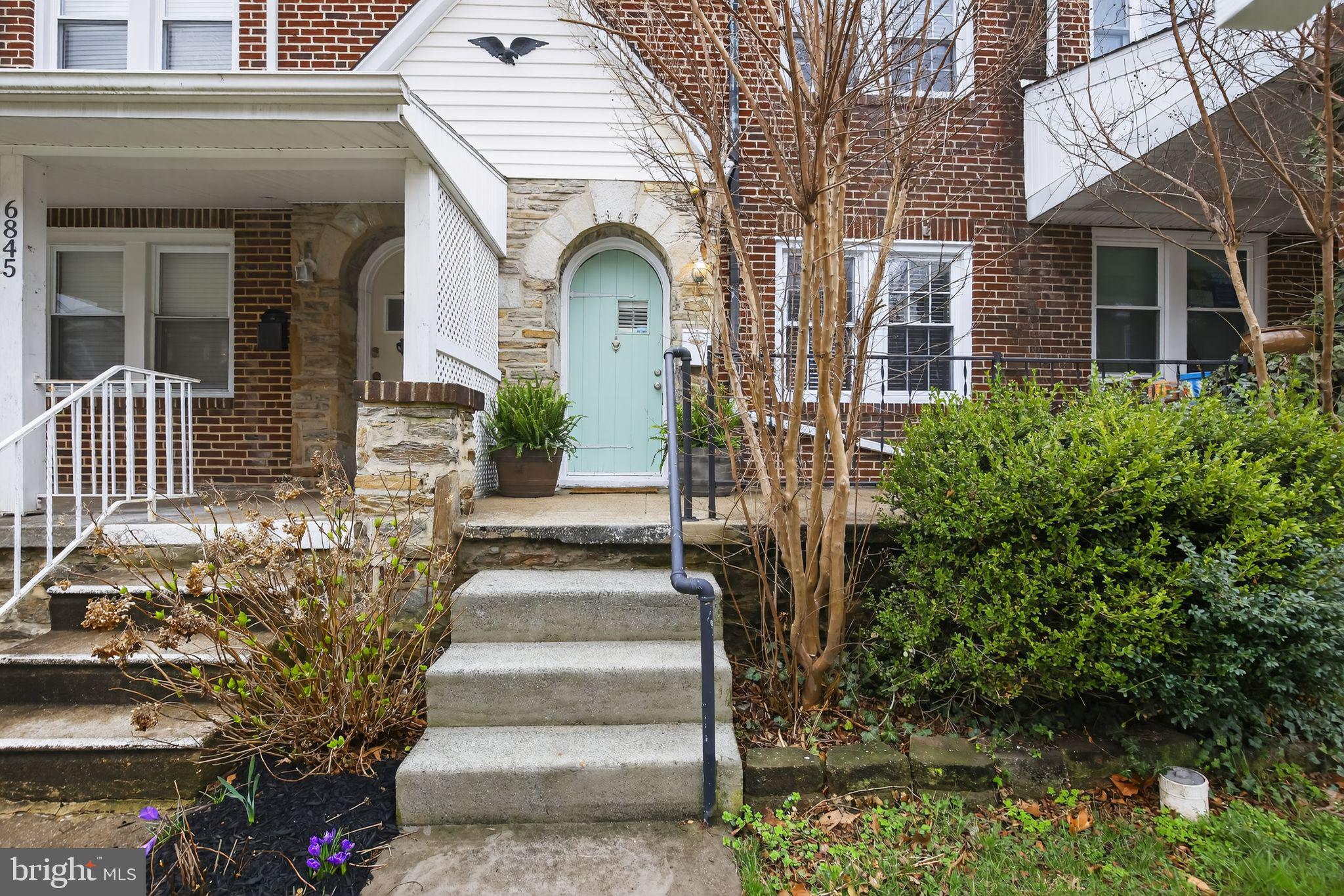 6843 Dunbar Road Baltimore, MD 21222 - Photo 1 of 27 a front view of a house with a garden