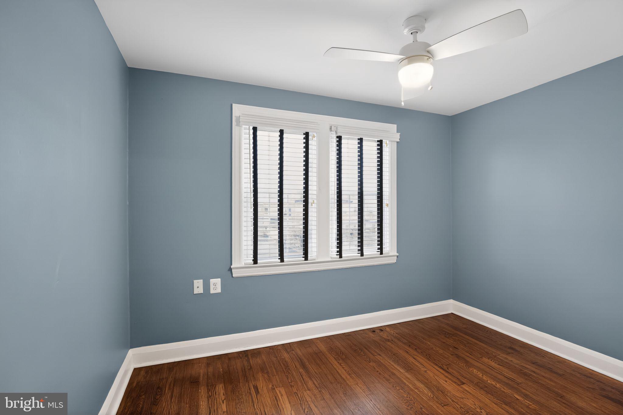 6843 Dunbar Road Baltimore, MD 21222 - Photo 16 of 27 a view of empty room with wooden floor