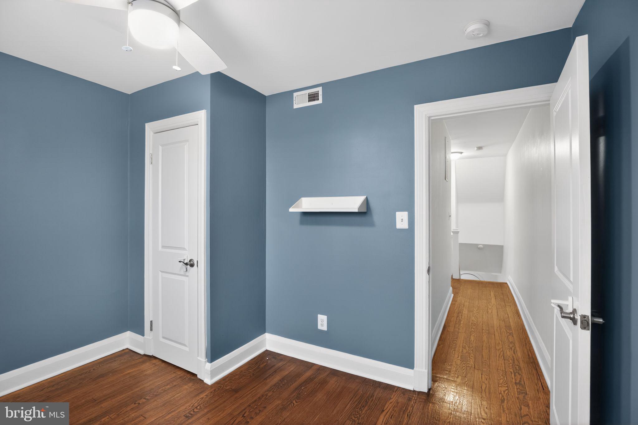 6843 Dunbar Road Baltimore, MD 21222 - Photo 18 of 27 an empty room and wooden floor
