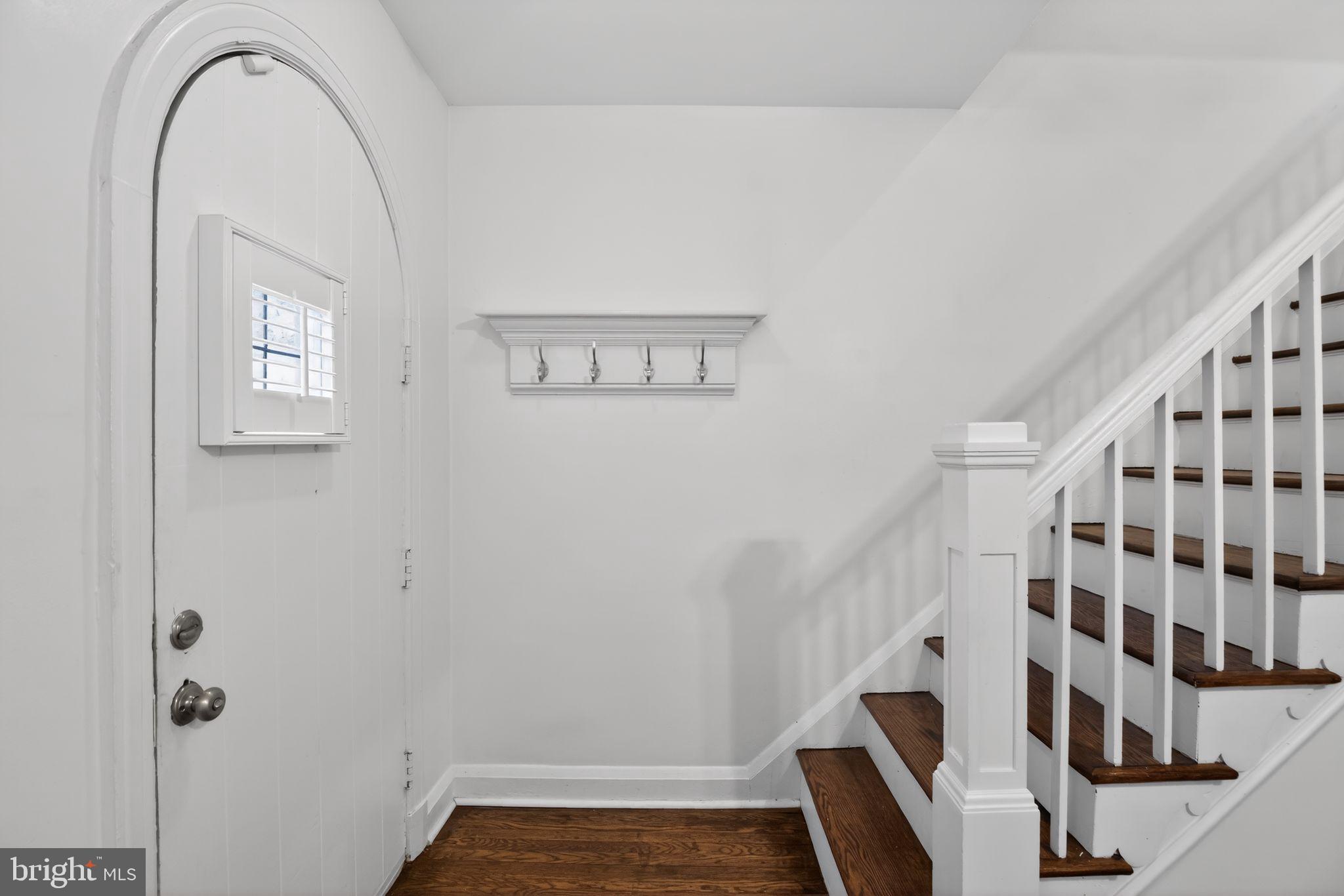 6843 Dunbar Road Baltimore, MD 21222 - Photo 2 of 27 a view of wooden staircase and utility room with windows
