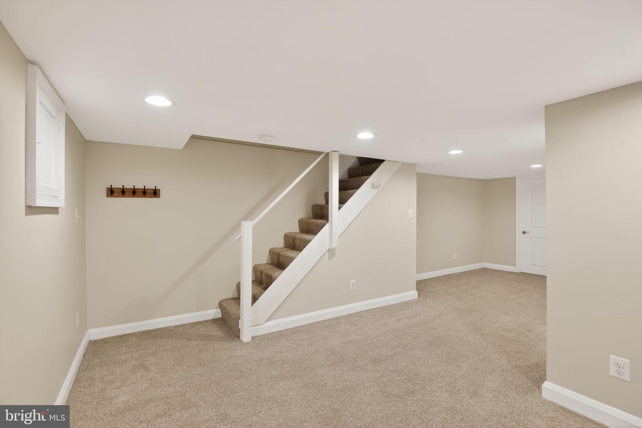 6843 Dunbar Road Baltimore, MD 21222 - Photo 21 of 27 a view of an empty room with stairs