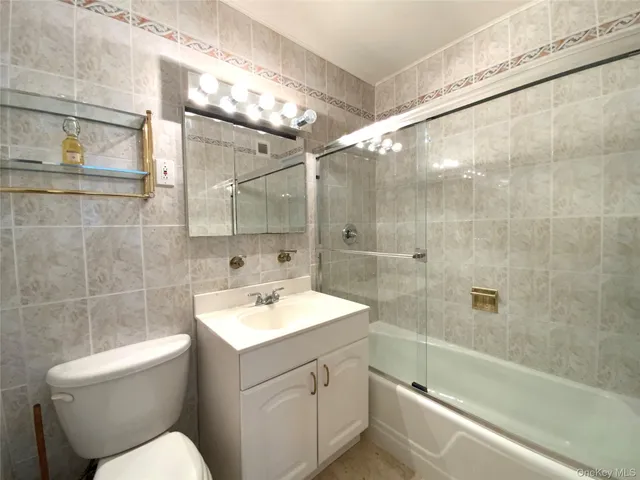 a dining room with furniture and a chandelier