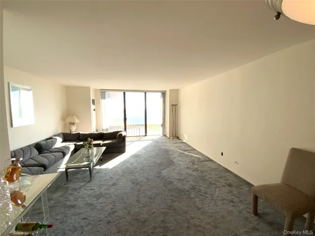 a living room with furniture and white walls