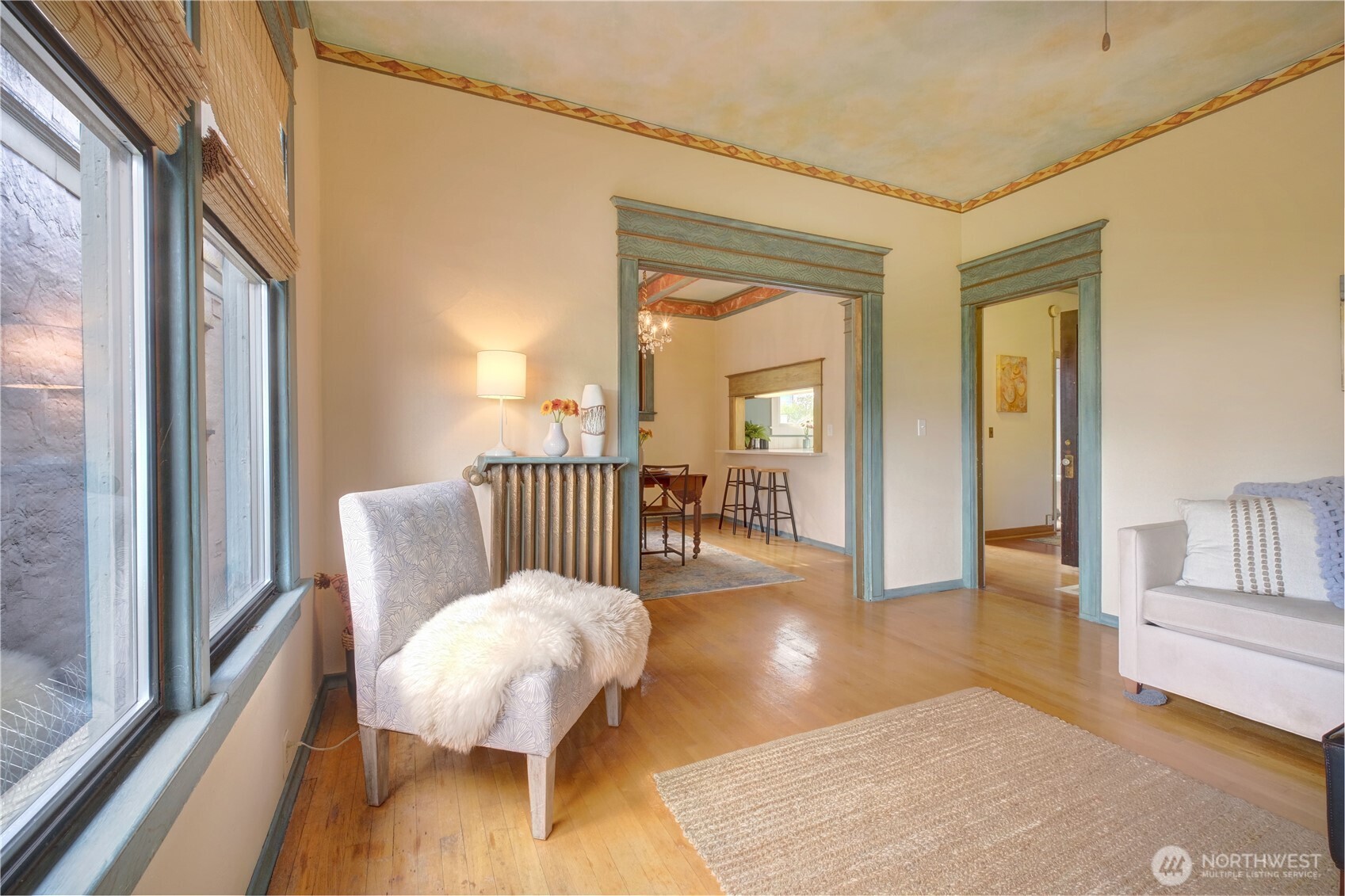 409 16th Avenue East, Unit 21 Seattle, WA 98112 - Photo 12 of 25 a view of a livingroom with wooden floor and furniture