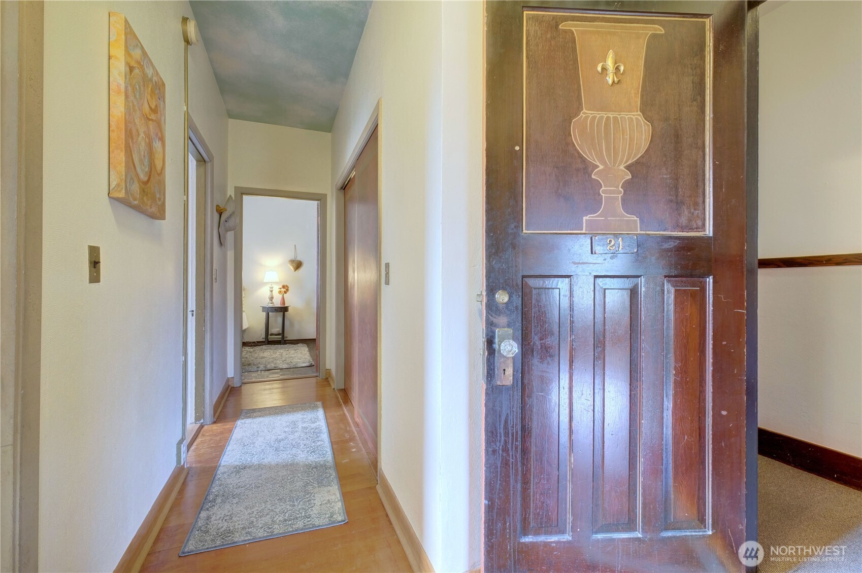409 16th Avenue East, Unit 21 Seattle, WA 98112 - Photo 7 of 25 a view of a hallway with wooden floor