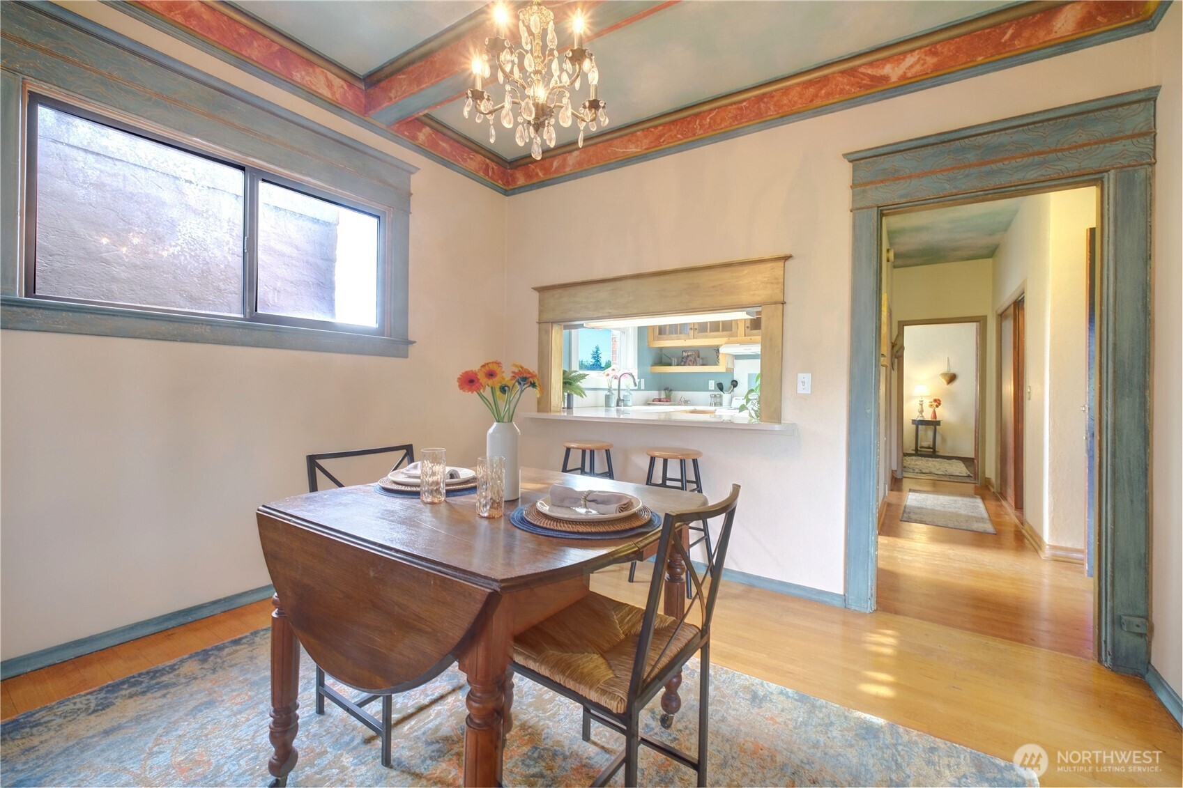 409 16th Avenue East, Unit 21 Seattle, WA 98112 - Photo 9 of 25 a view of a dining room with furniture a chandelier and wooden floor