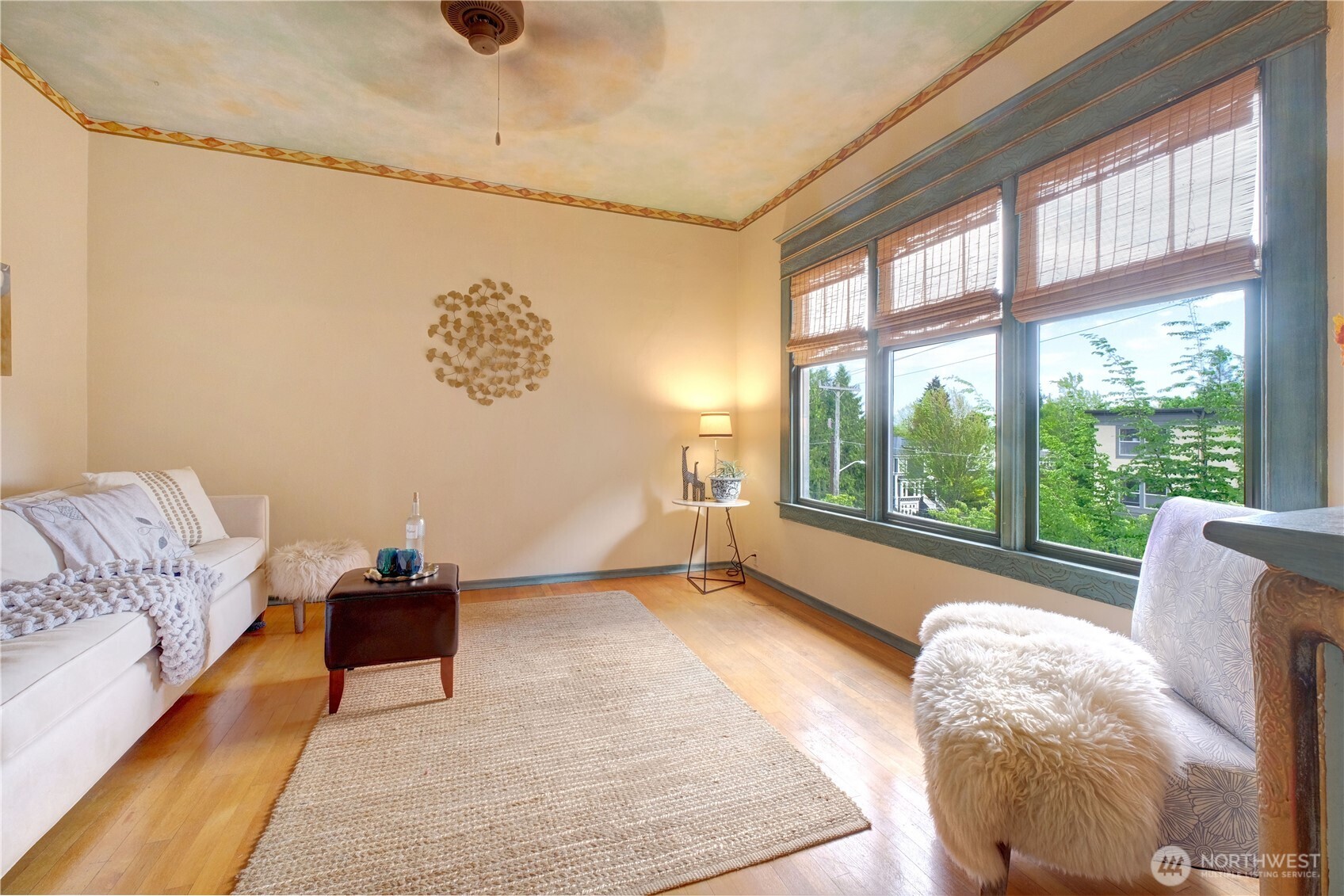 409 16th Avenue East, Unit 21 Seattle, WA 98112 - Photo 10 of 25 a living room with furniture and a large window