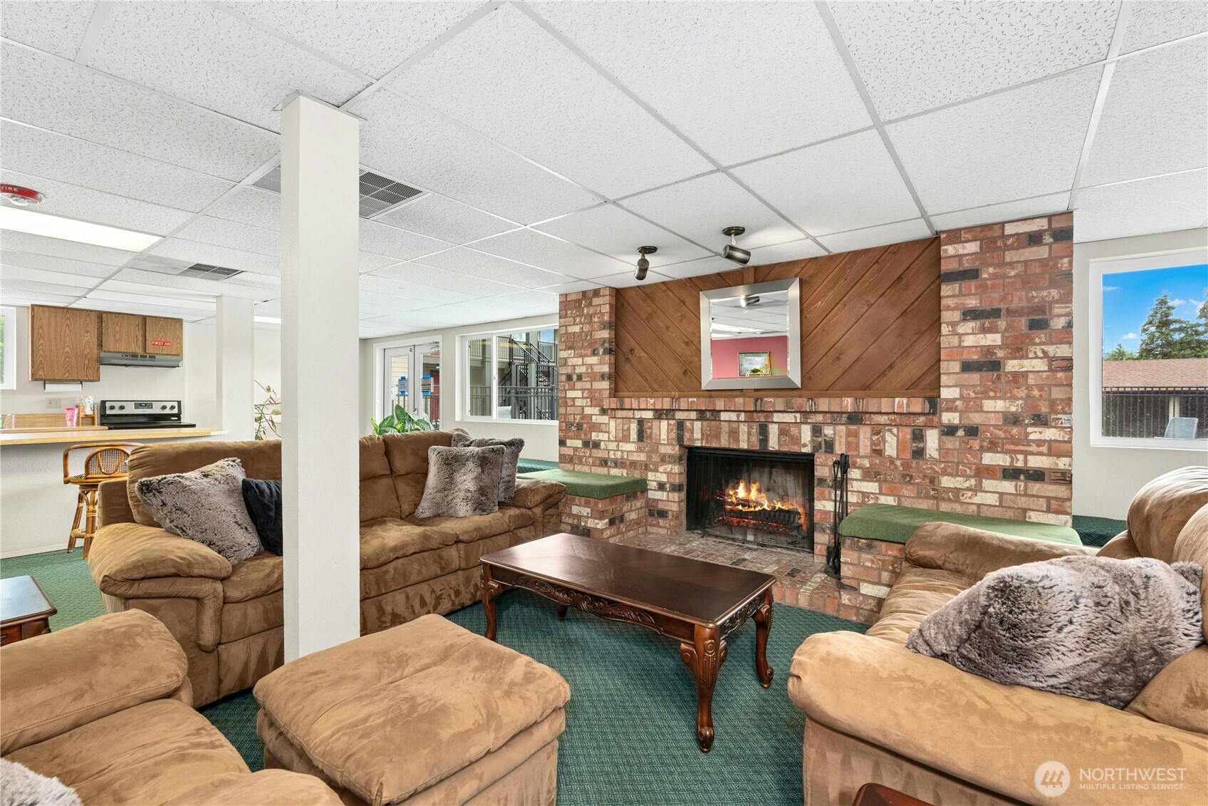 9523 Northeast 180th Street, Unit A102 Bothell, WA 98011 - Photo 26 of 29 a living room with furniture and a fireplace