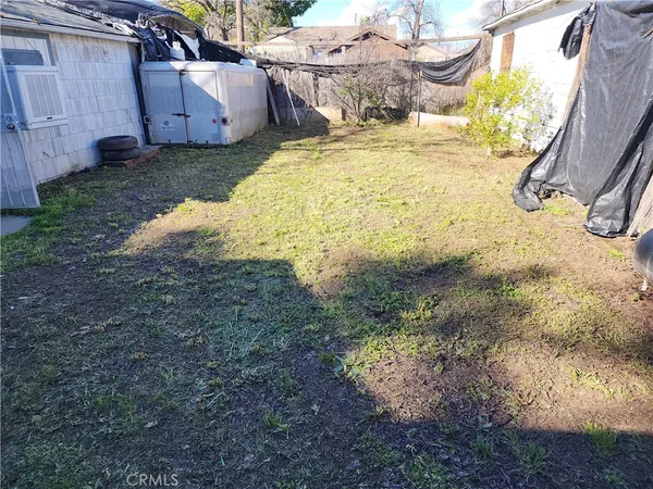 a view of a backyard of the house