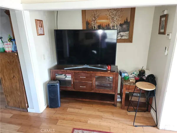 a room with furniture and a flat screen tv