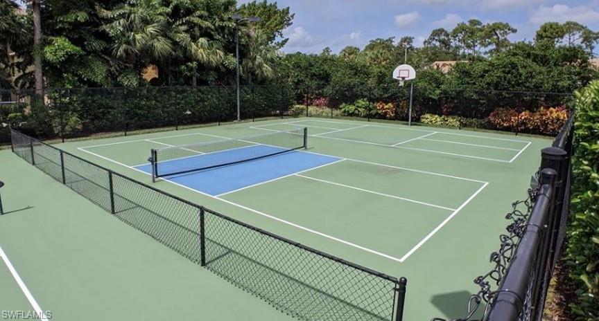 9128 Delano Street, Unit 892 Naples, FL 34113 - Photo 45 of 49 a tennis court that has tennis net