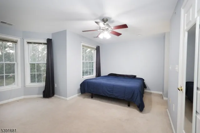 a room with a bed and window