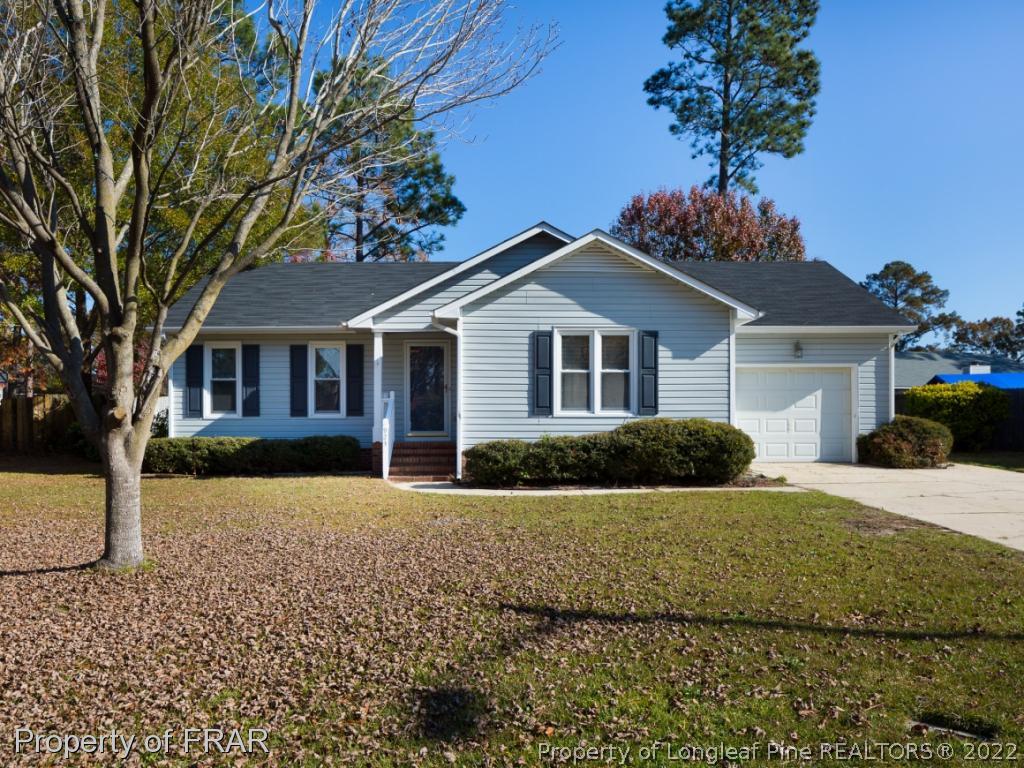 923 Rim Road Fayetteville, NC 28314 - Photo 1 of 21 a front view of a house with a yard