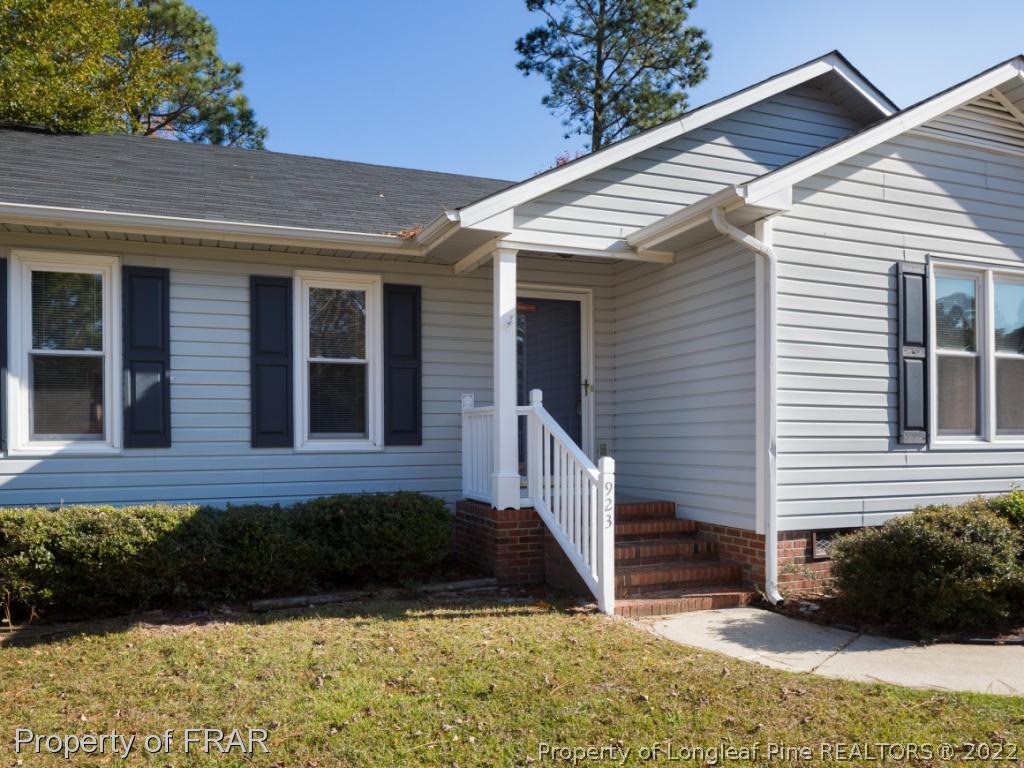 923 Rim Road Fayetteville, NC 28314 - Photo 2 of 21 a view of a house with a yard