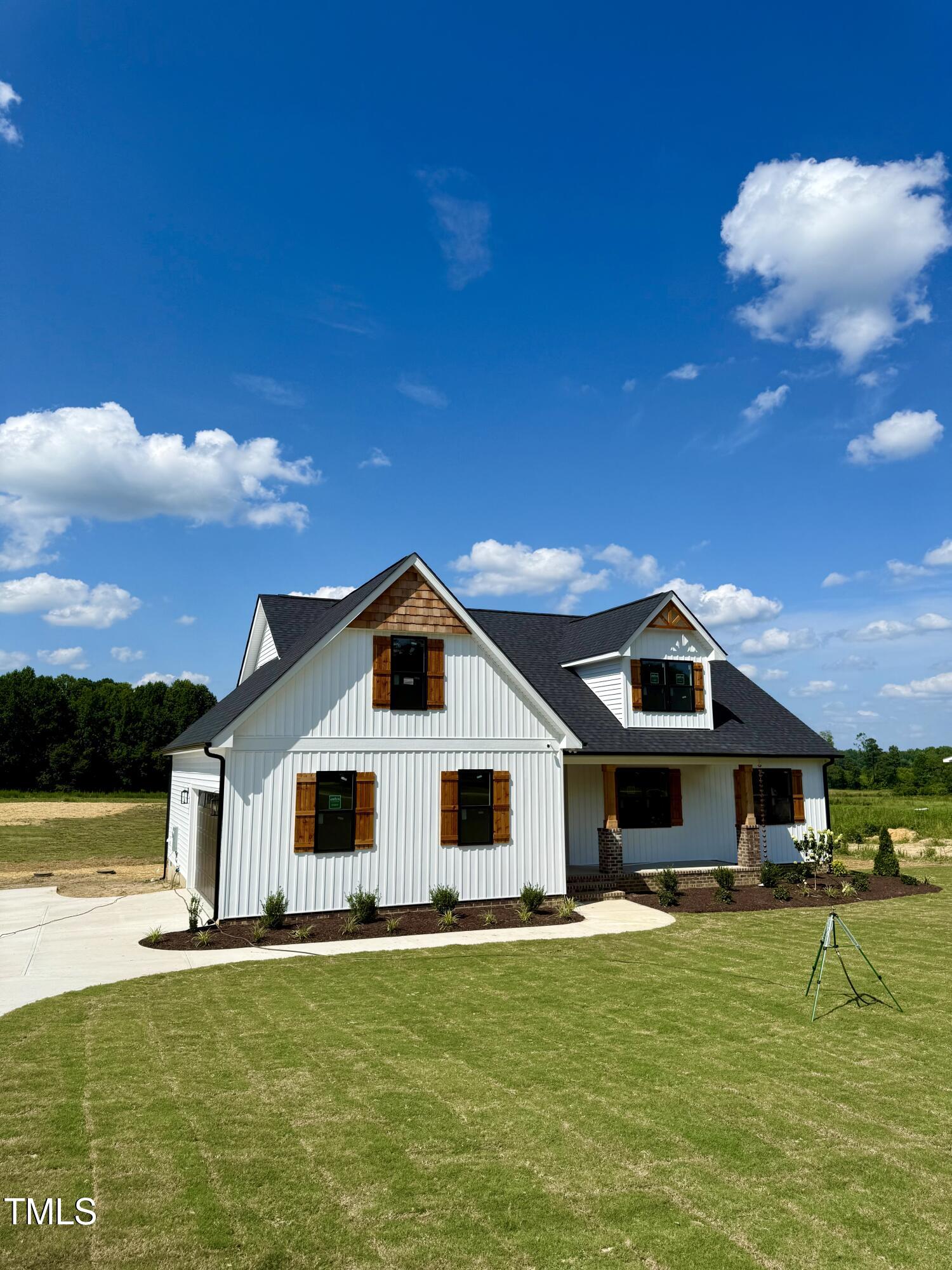 6930 Fire Tower Road Spring Hope, NC 27882 - Photo 2 of 33 a front view of a house with a yard