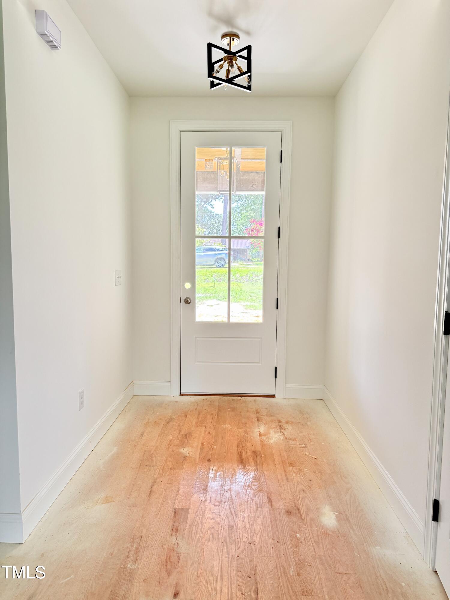 6930 Fire Tower Road Spring Hope, NC 27882 - Photo 3 of 33 a view of an empty room with a window