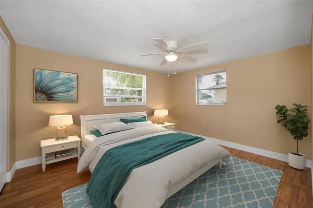 a bedroom with bed and a window