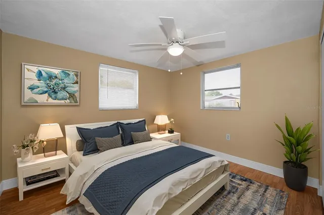 a bedroom with bed and a window