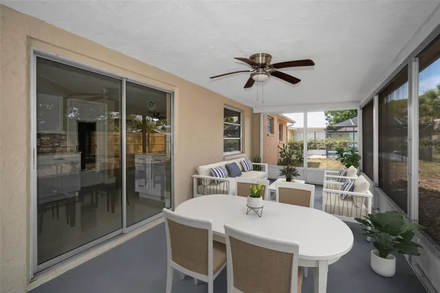 a dining room with furniture window and wooden floor