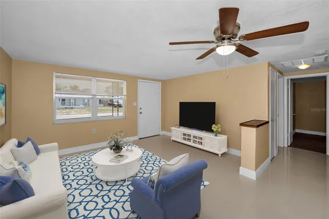 a living room with furniture and a flat screen tv