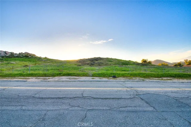a view of a mountain range with lush green forest