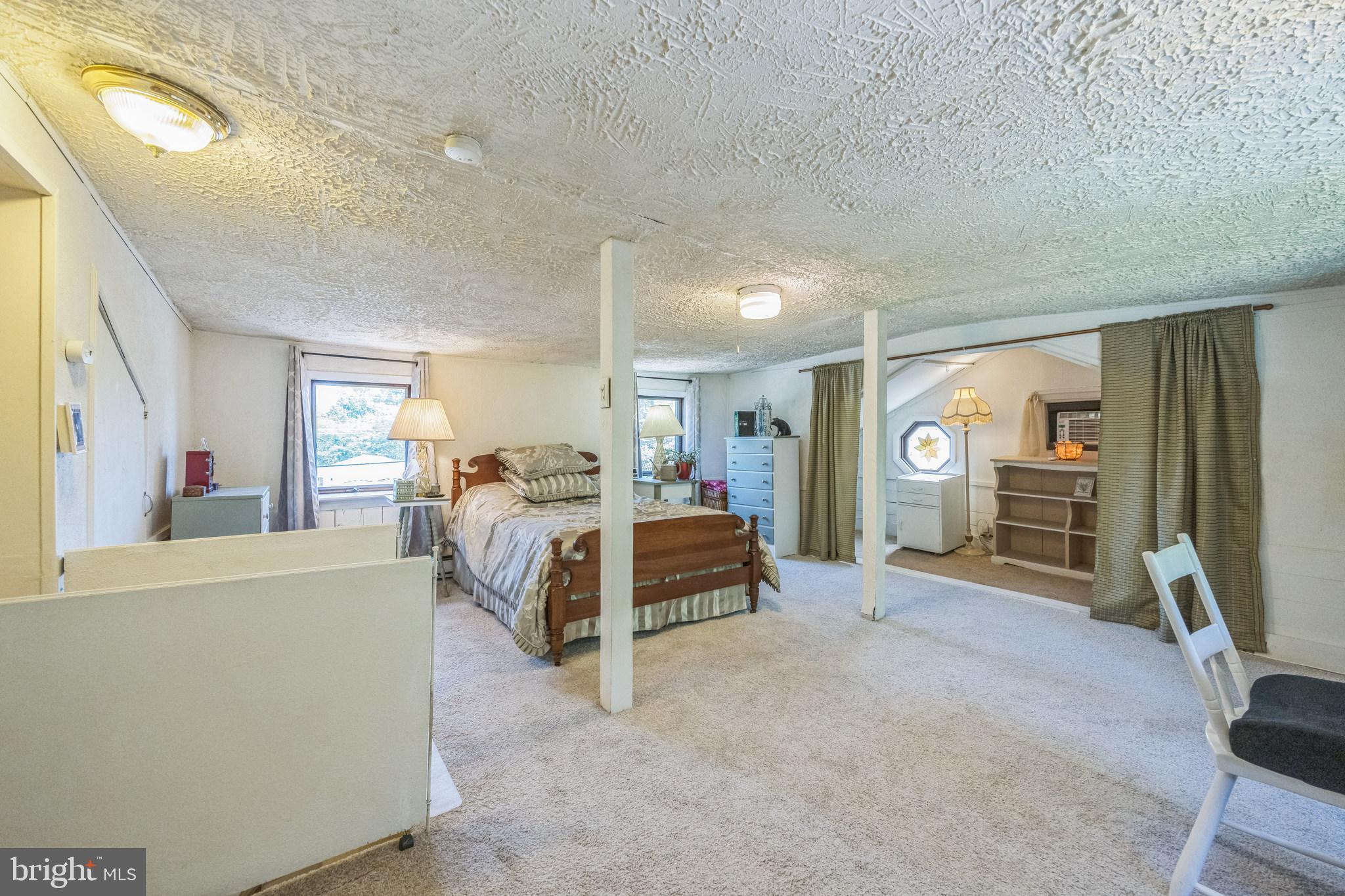 69 Oberlin Road Pennsville, NJ 08070 - Photo 12 of 21 a bed room with a bed and a large window